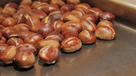 Delicious grilled chestnuts on the tray Stock Footage 87726765