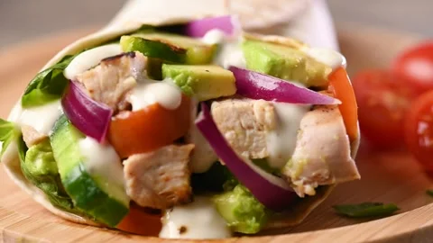 A delicious grilled chicken wrap Stock Footage 310250036