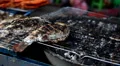 Delicious grilled fish on sale on the streets of Bangkok, Thailand HD Footage