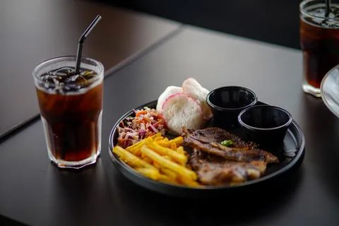Delicious grilled marinated lamb chops and French fries Stock Photos