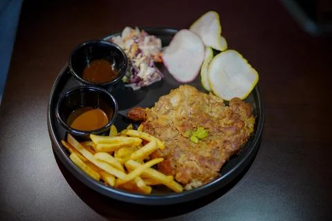 Delicious grilled marinated lamb chops and French fries Stock Photos