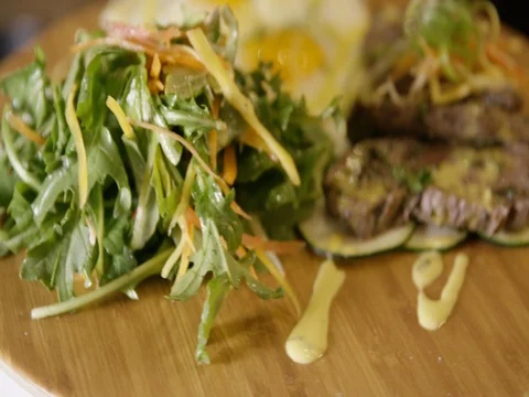 Delicious half fried egg and roasted meat on wooden board 스톡 동영상 83185341