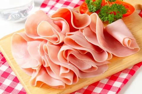 Delicious ham slices on a bread roll 스톡 사진