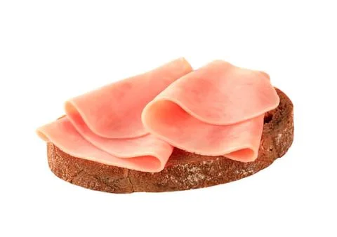 Delicious ham slices on dark bread Stock Photos