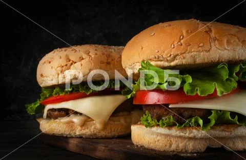 A delicious hamburger with a cutlet and cheese. Stock Photos