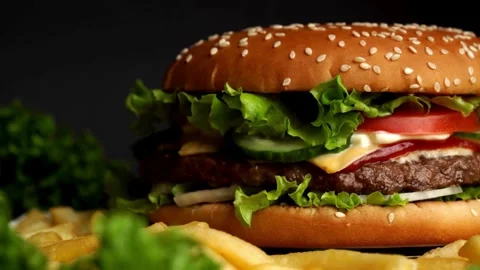 Delicious hamburger with grilled beef steak served on chef's table 4k footage Video stock 336578793