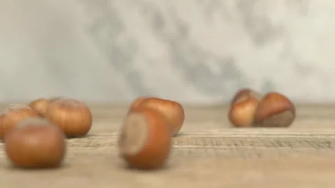 Delicious Hazelnuts Happily Falling on a Beautiful Rustic Wooden Surface for All 스톡 동영상 286713482