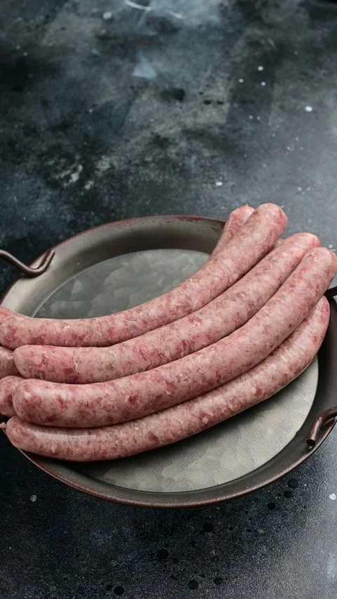 Delicious homemade sausage preparation in a rustic kitchen setting Stock Footage 305232121