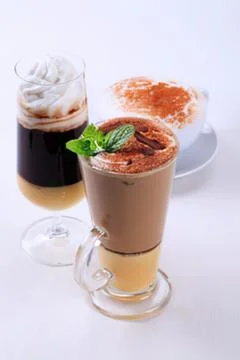 Delicious iced coffee drinks with mint garnish Stock Photos