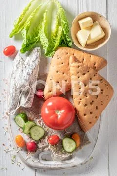 Delicious ingredients for sandwich with cheese, tomato and radish Stock Photos