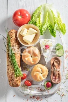 Delicious ingredients for sandwich with lettuce, tomato and chives Stock Photos