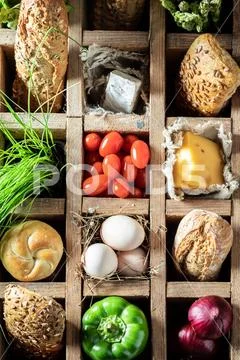Delicious ingredients for sandwich in a old wooden box Stock Photos