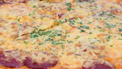 Delicious italian pizza close up. Loop motion. Side view. Stock Footage 170489440