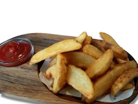 Delicious large pieces of french fries with ketchup on a wooden tray  with co Stock Photos