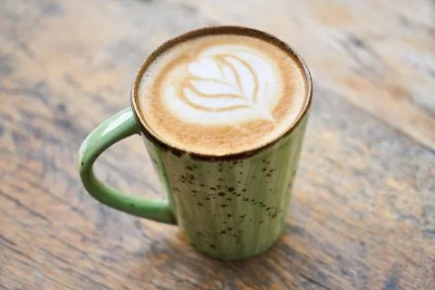 Delicious latte coffee on a table Stock Photos