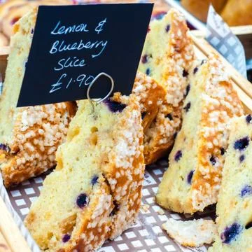 Delicious lemon and raspberry cake slices in British market Stock Photos