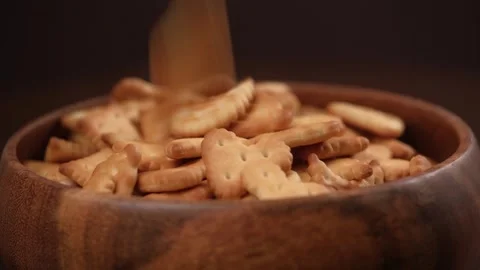 Delicious little cracker cookie falls onto the plate. cooking, bakery. closeup. Stock Footage 241499530
