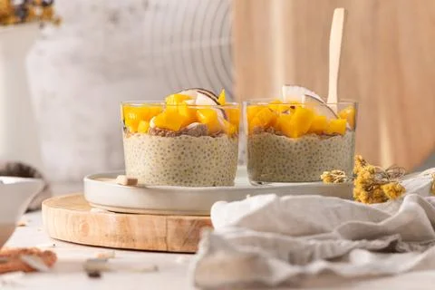 Delicious mango chia seed pudding layered with crunchy granola and fresh co.. Stock Photos