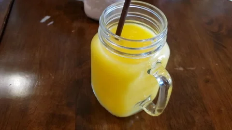 Delicious mango smoothie.4K Stock Footage 178677445