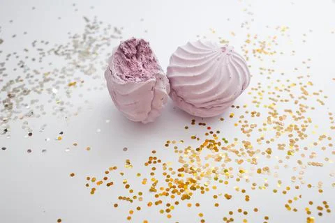 Delicious marshmallows on a white background with a bright decor Stock Photos