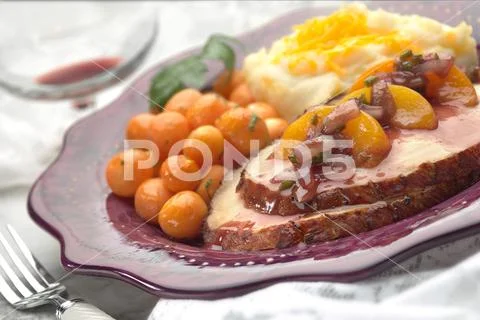 Delicious Meal with Turkey, Peaches and Vegetables Stock Photos