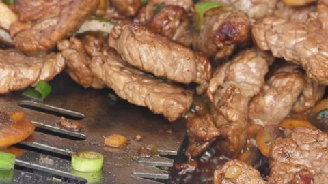 Delicious Meat and Vegetable Stir-Fry in a Wok Stock Footage 247261085