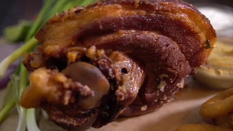Delicious meat dish with grilled pork and sausages. Delicious food in restaurant Stock Footage 103701853