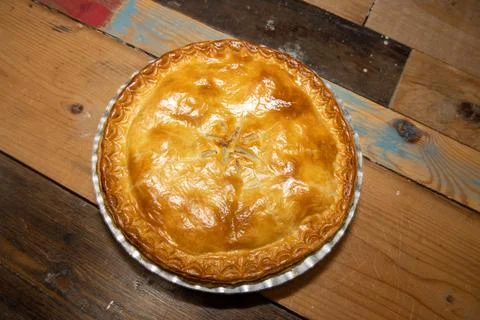 A delicious meat pie top down view showing the tasty meat pie and crust toppi Stock Photos