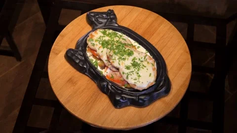 Delicious meat steak, chops with vegetable, creamy sauce rotates on wooden board Stock Footage 132828634