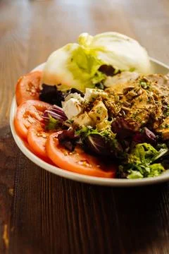 Delicious meat with vegetables served on plate Stock Photos