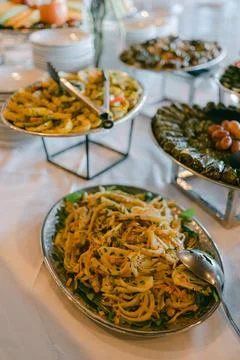 Delicious Mediterranean buffet featuring various dishes at a festive gathering Stock Photos