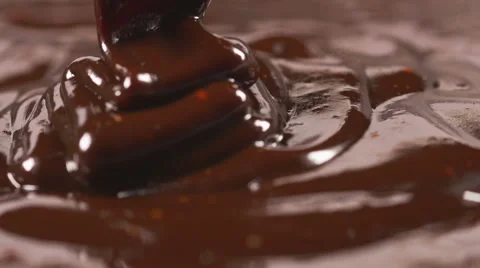 Delicious melted chocolate pouring Stock Footage 59665172