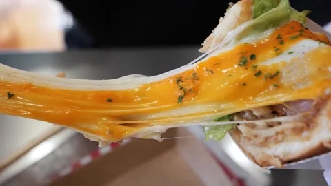 Delicious Melting Cheese Pull on a Toasted Sandwich Stock Footage 331956040