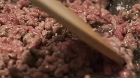 Delicious Minced Beef Meat Macro View Stirring with Wooden Spoon Stock Footage 145723604
