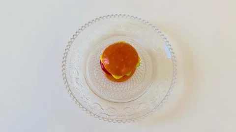 A Delicious Mini Burger served on an Elegant Glass Plate, perfect for any Stock Photos