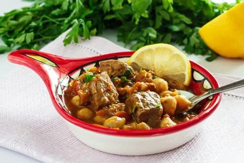 Delicious Moroccan soup harira with meat, chickpeas, lentils, tomatoes. Stock Photos