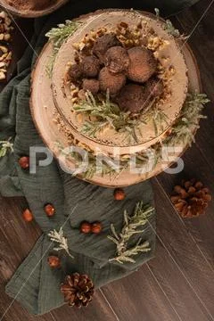 Delicious naked chocolate and hazelnuts cake on table rustic wood kitchen cou Stock Photos