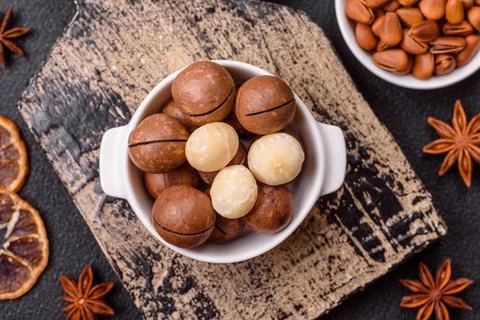 Delicious nutritious macadamia nuts in ceramic bowl Stock Photos