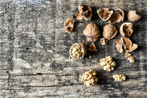 Delicious nuts and nutcrackers on an old wooden table, copyspace, set Stock Photos
