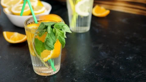 Delicious orangeade with mint in a glass Stock Footage 89345936
