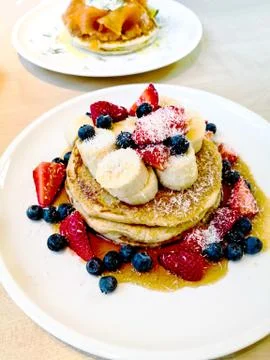 Delicious pancake stack with honey Stock Photos