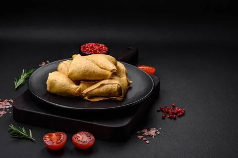 Delicious pancakes triangular shape with meat, salt and spices Delicious p... 스톡 사진