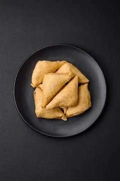 Delicious pancakes triangular shape with meat, salt and spices Delicious p... 스톡 사진