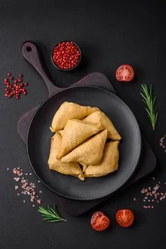 Delicious pancakes triangular shape with meat, salt and spices Delicious p... Stock Photos