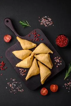 Delicious pancakes triangular shape with meat, salt and spices Delicious p... 스톡 사진