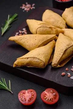 Delicious pancakes triangular shape with meat, salt and spices Delicious p... Stock Photos