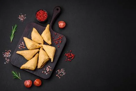 Delicious pancakes triangular shape with meat, salt and spices Delicious p... Foto stock