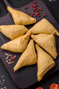 Delicious pancakes triangular shape with meat, salt and spices Delicious p... Stock Photos