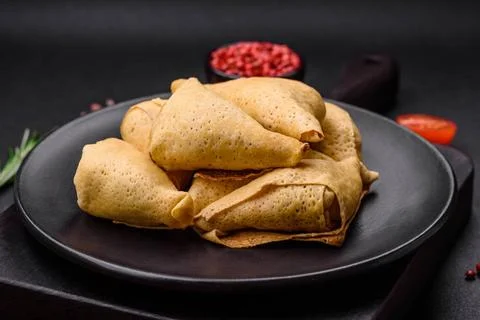Delicious pancakes triangular shape with meat, salt and spices Delicious p... Stock Photos