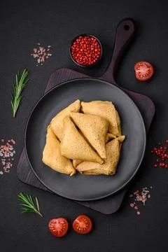 Delicious pancakes triangular shape with meat, salt and spices Delicious p... Stock Photos
